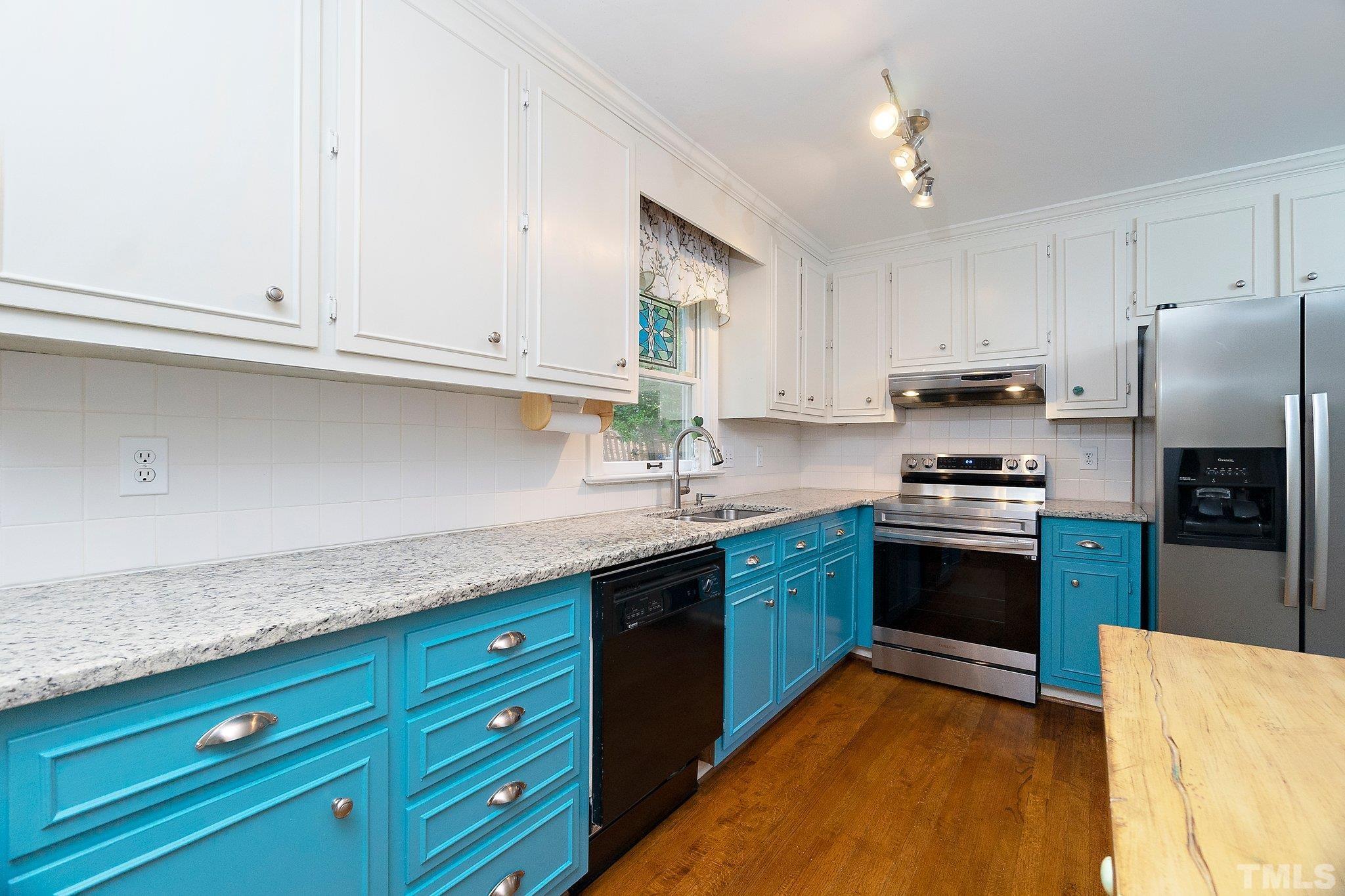 612 Morningside Drive Durham, NC 27713 - Photo 15 of 36 a kitchen with granite countertop cabinets stainless steel appliances and a counter space