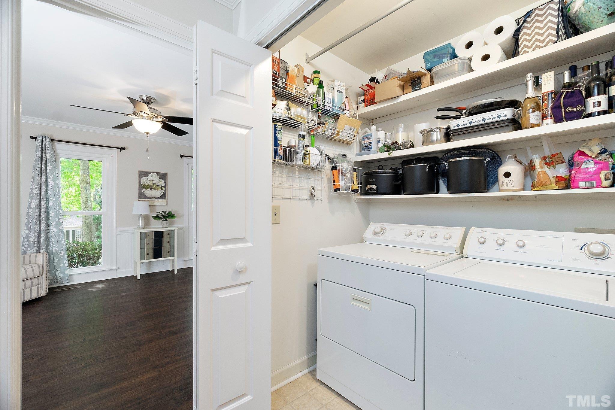 612 Morningside Drive Durham, NC 27713 - Photo 19 of 36 a view of washer and dryer with kitchen flooring