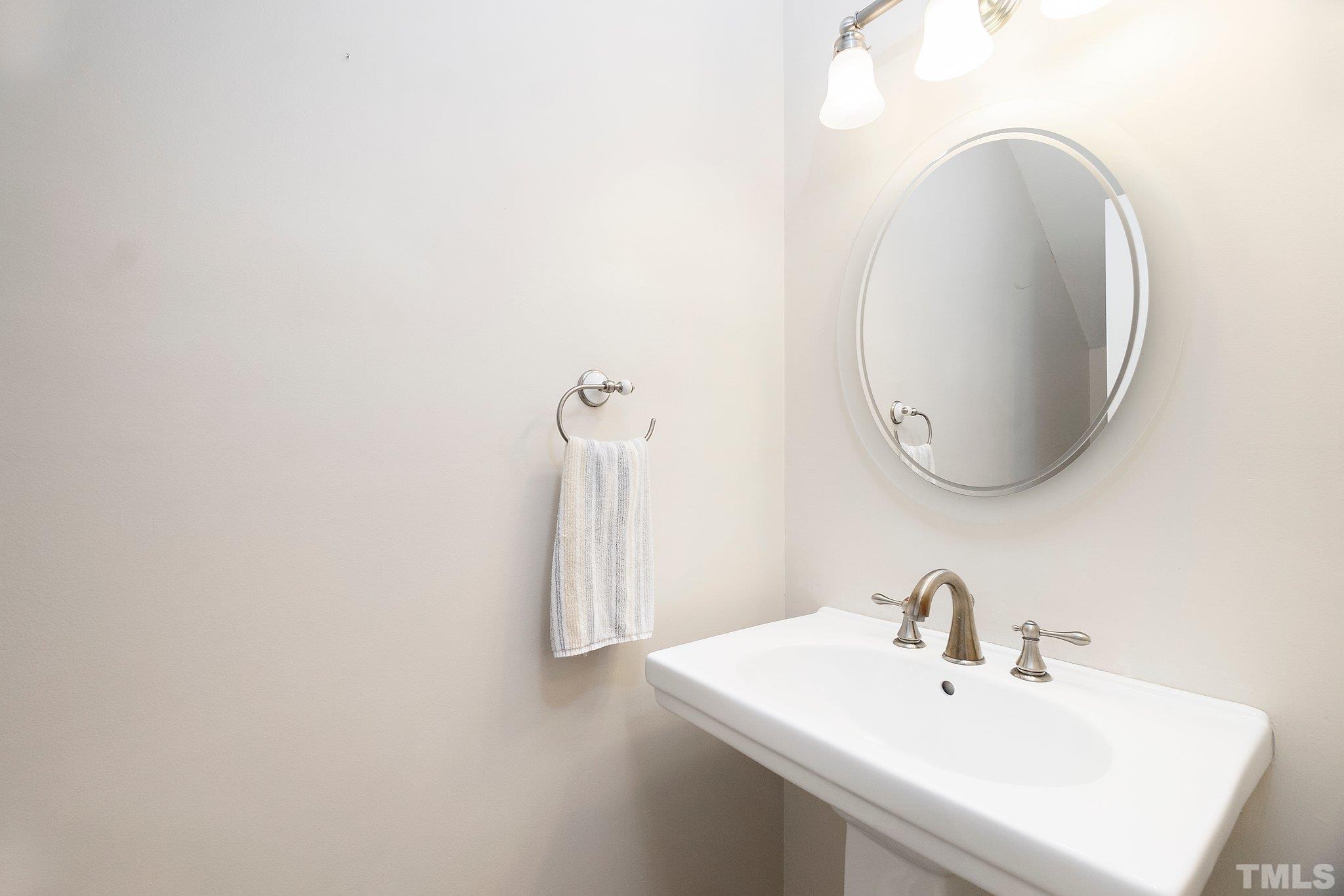 612 Morningside Drive Durham, NC 27713 - Photo 20 of 36 a bathroom with a sink and a mirror