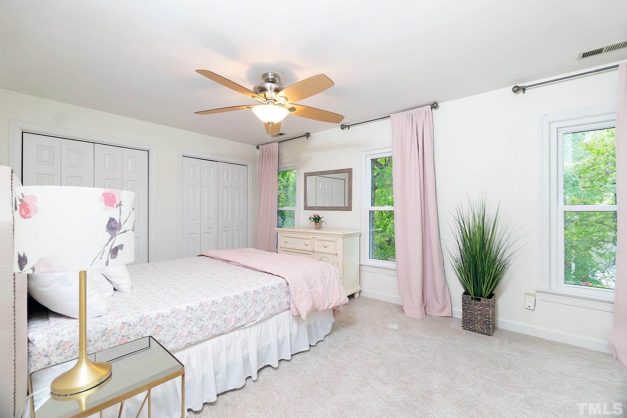 612 Morningside Drive Durham, NC 27713 - Photo 21 of 36 a bedroom with a bed and a large window