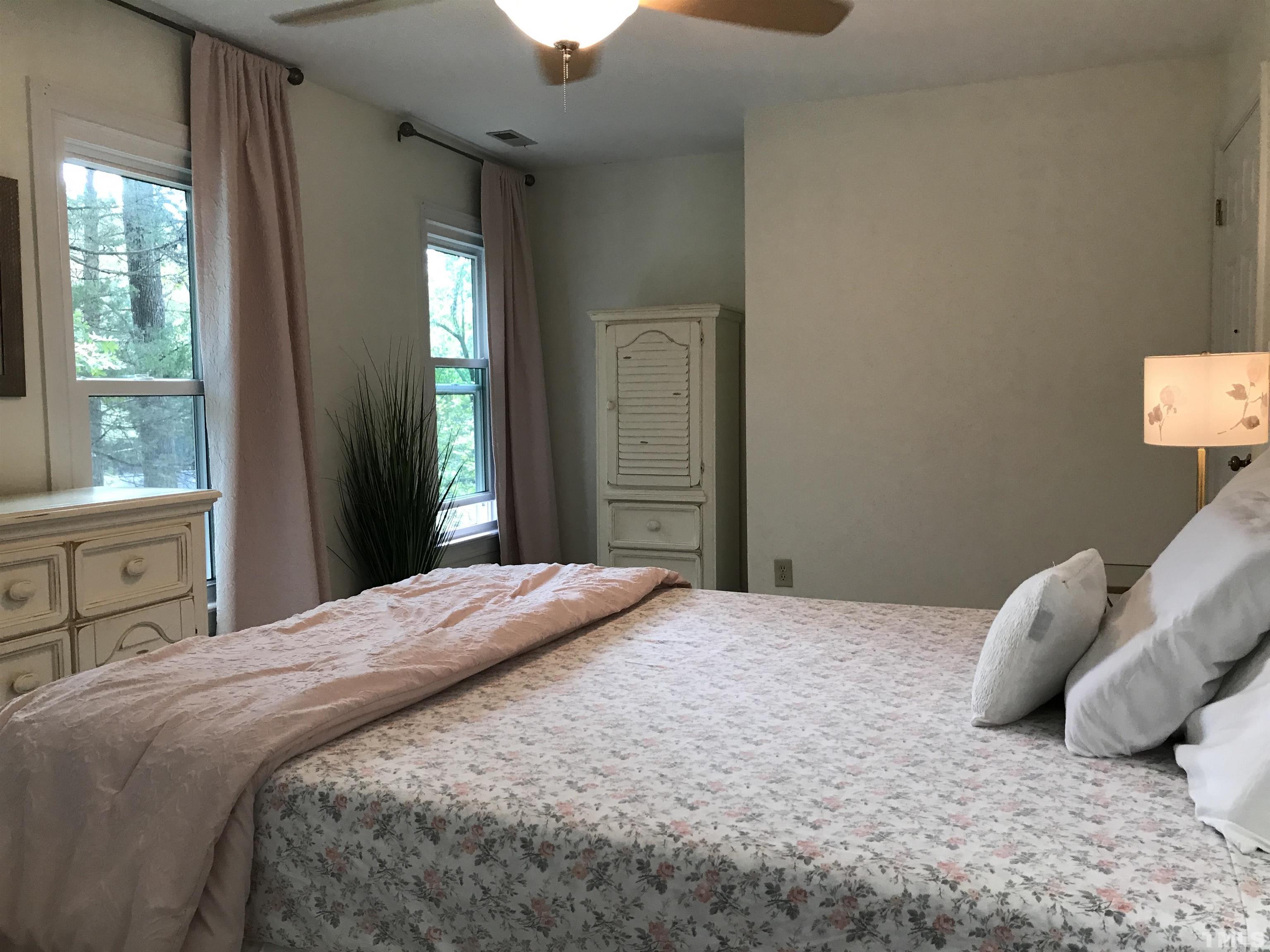 612 Morningside Drive Durham, NC 27713 - Photo 22 of 36 a bedroom with a bed and a window