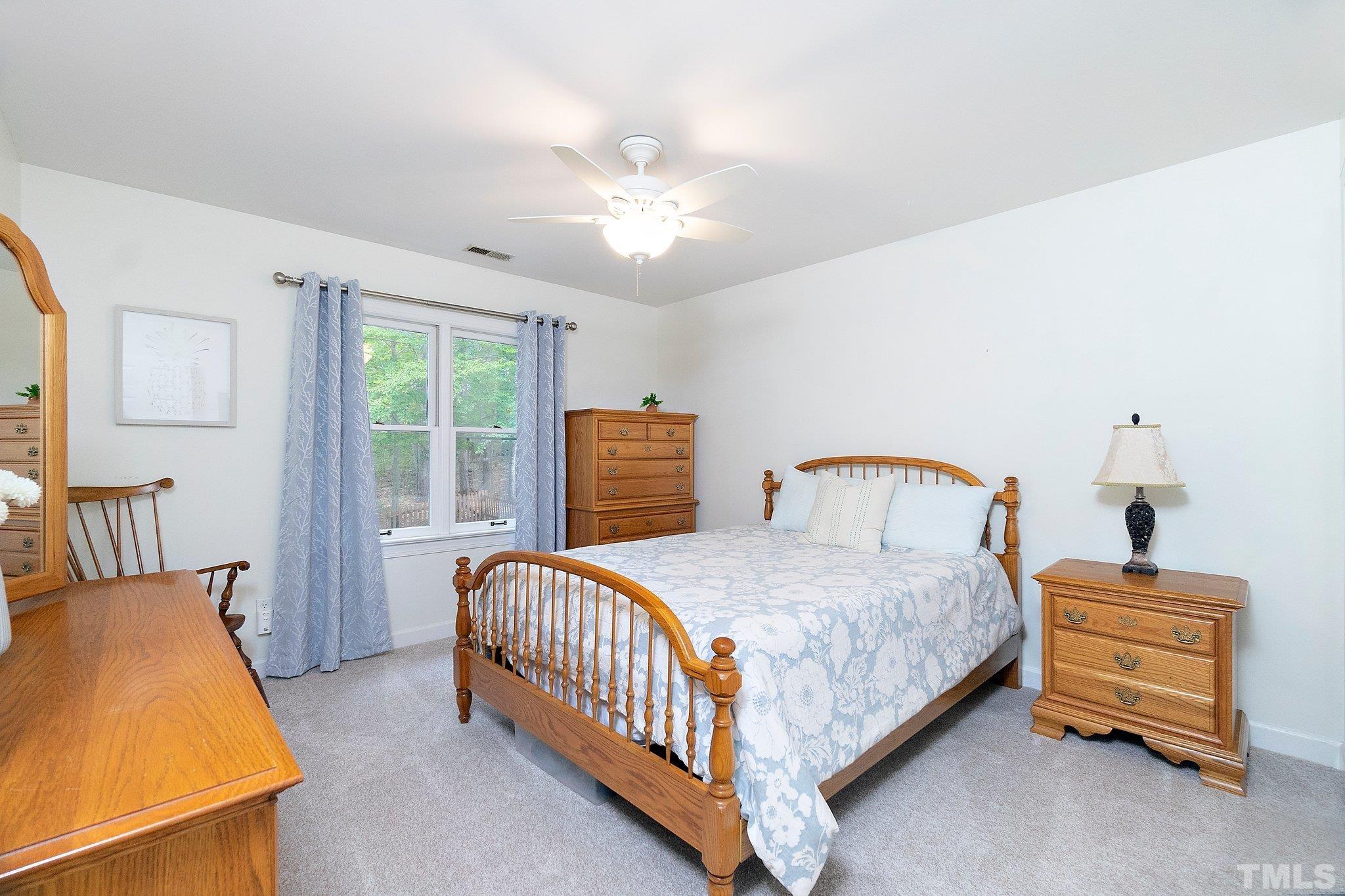 612 Morningside Drive Durham, NC 27713 - Photo 24 of 36 a bedroom with a bed and a window