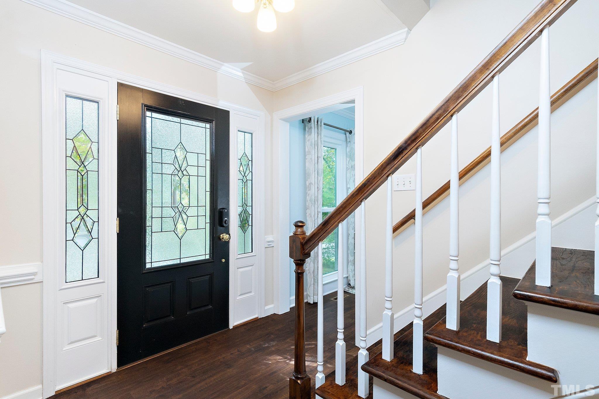 612 Morningside Drive Durham, NC 27713 - Photo 6 of 36 a view of an entryway with wooden floor and staircase