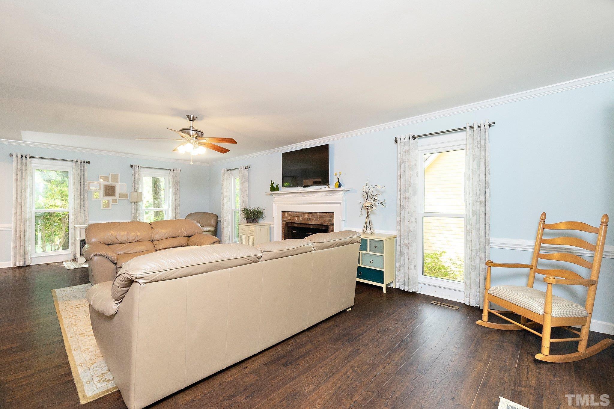612 Morningside Drive Durham, NC 27713 - Photo 10 of 36 a living room with furniture and a flat screen tv