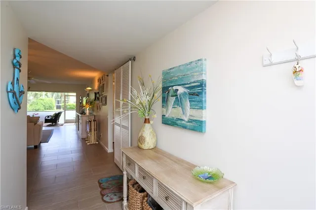 a view of a hallway with seating area