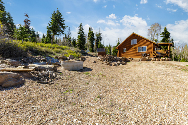 706 Tranquility Drive Springdale, UT 84767 - Photo 35 of 55 Cleared Entry Space: Wide-open space at the front of the cabin for parking and access.
