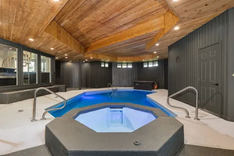 a room with furniture and pool table