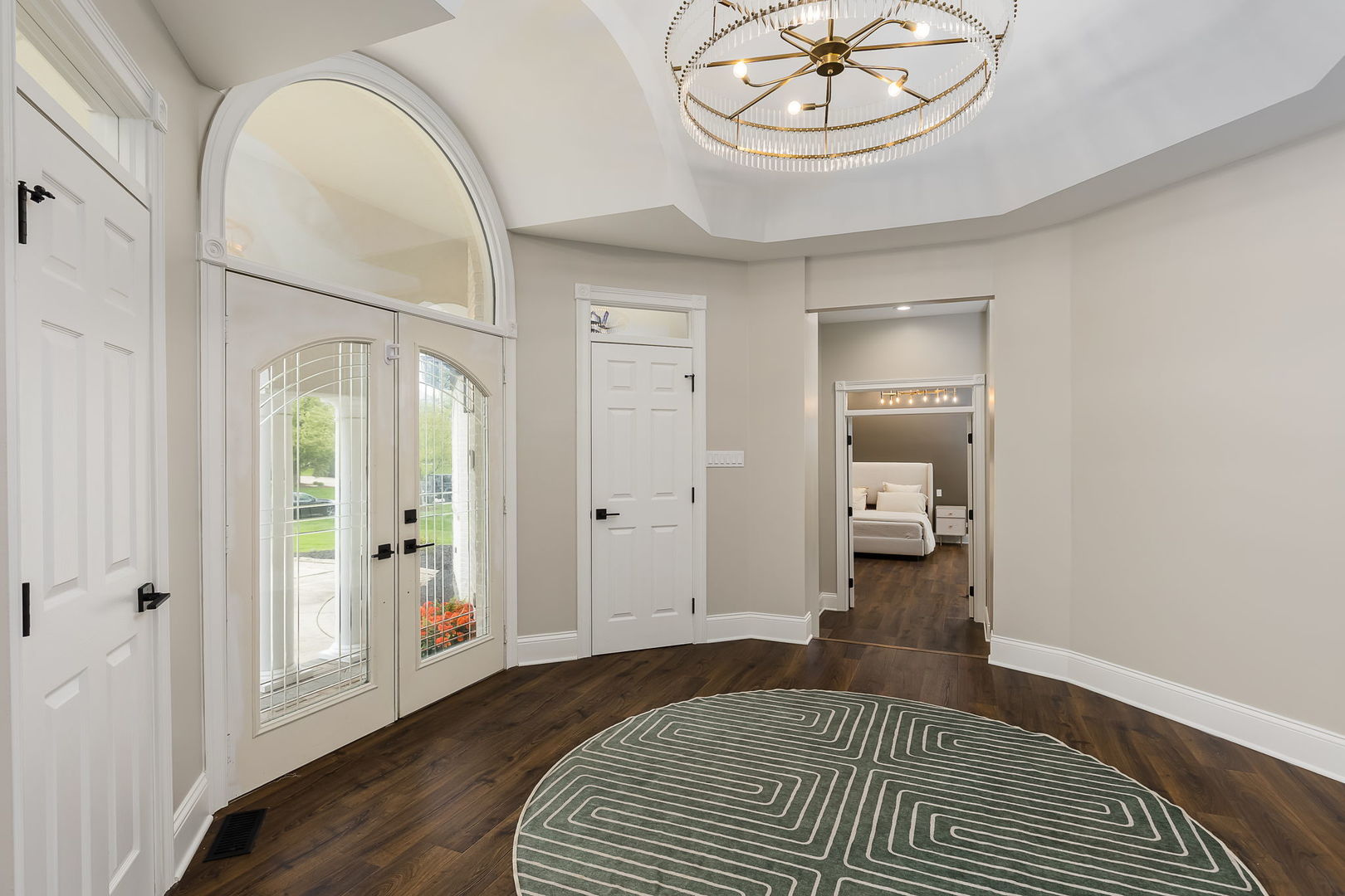 7 Loblolly Court Lemont, IL 60439 - Photo 3 of 45 a bedroom with a bed and a chandelier