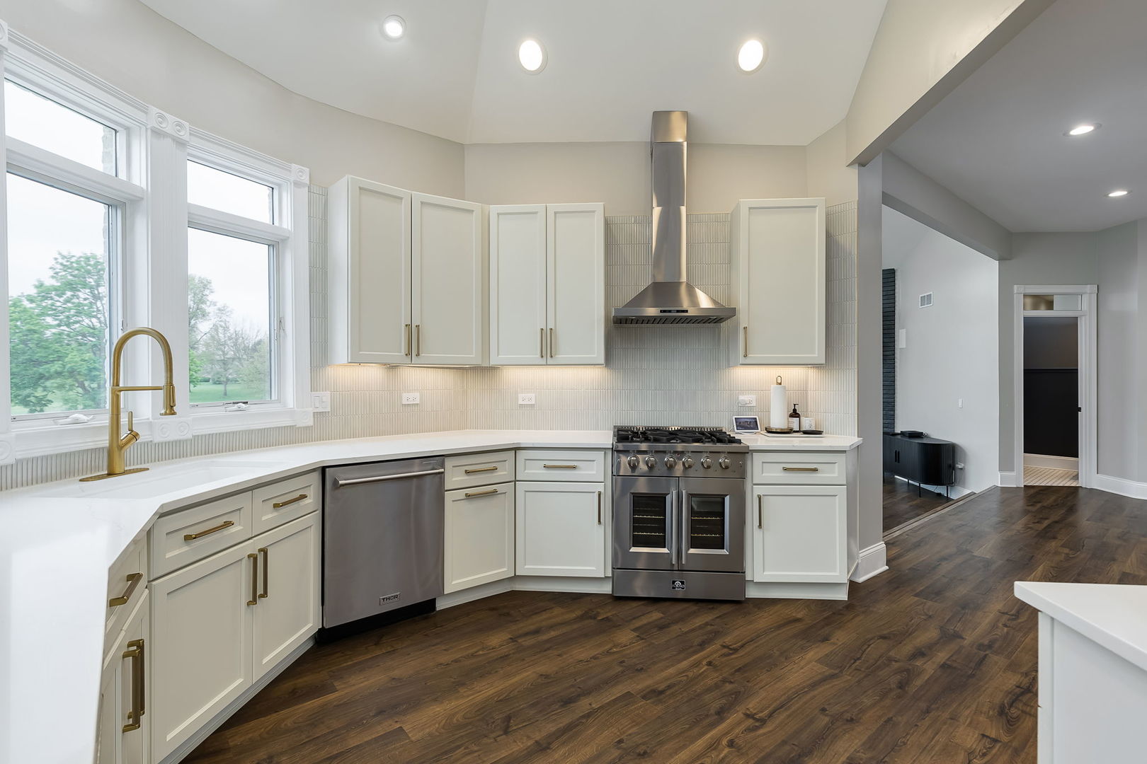 7 Loblolly Court Lemont, IL 60439 - Photo 6 of 45 a kitchen with stainless steel appliances granite countertop a stove a sink and a refrigerator