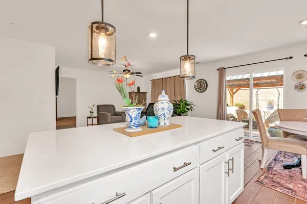 a kitchen with stainless steel appliances a stove a microwave and cabinets