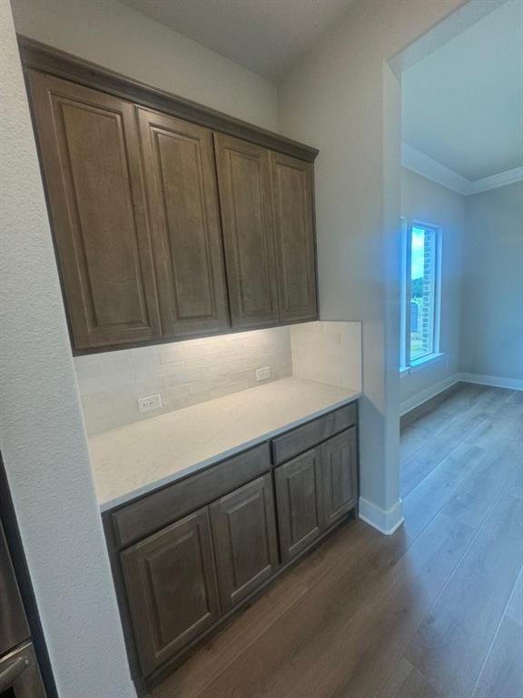 412 Indian Crk Road Van Alstyne, TX 75495 - Photo 11 of 24 a view of an empty room with wooden floor and a window