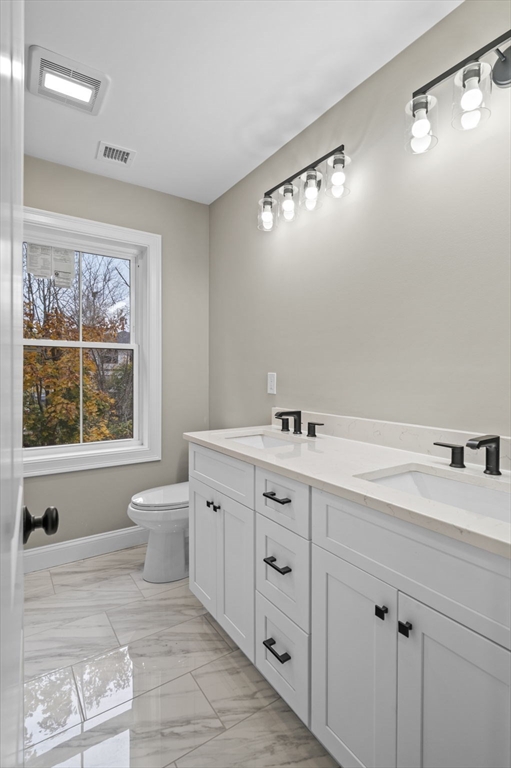 9 Acton Road, Unit 6 Chelmsford, MA 01824 - Photo 12 of 21 a spacious bathroom with a granite countertop sink mirror and bathtub