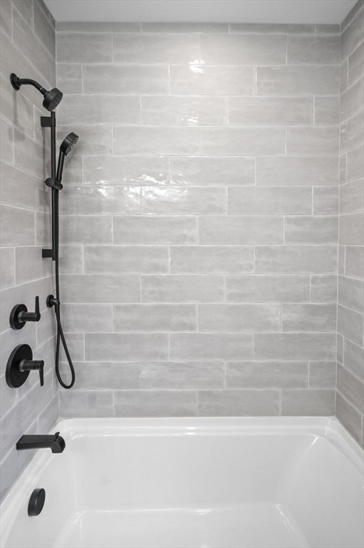 9 Acton Road, Unit 6 Chelmsford, MA 01824 - Photo 14 of 21 a bathroom with a shower