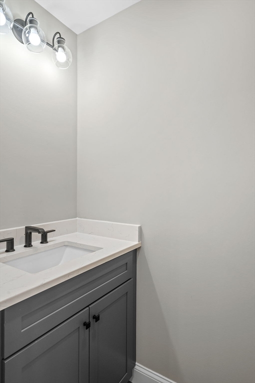 9 Acton Road, Unit 6 Chelmsford, MA 01824 - Photo 10 of 20 a bathroom with a sink and vanity