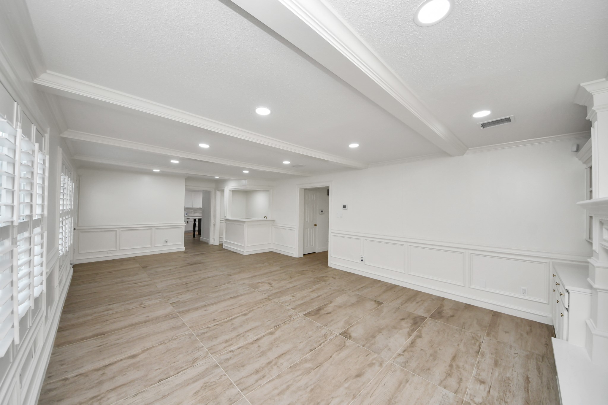 1719 Saddlecreek Drive Houston, TX 77090 - Photo 14 of 38 an empty room with wooden floor and windows