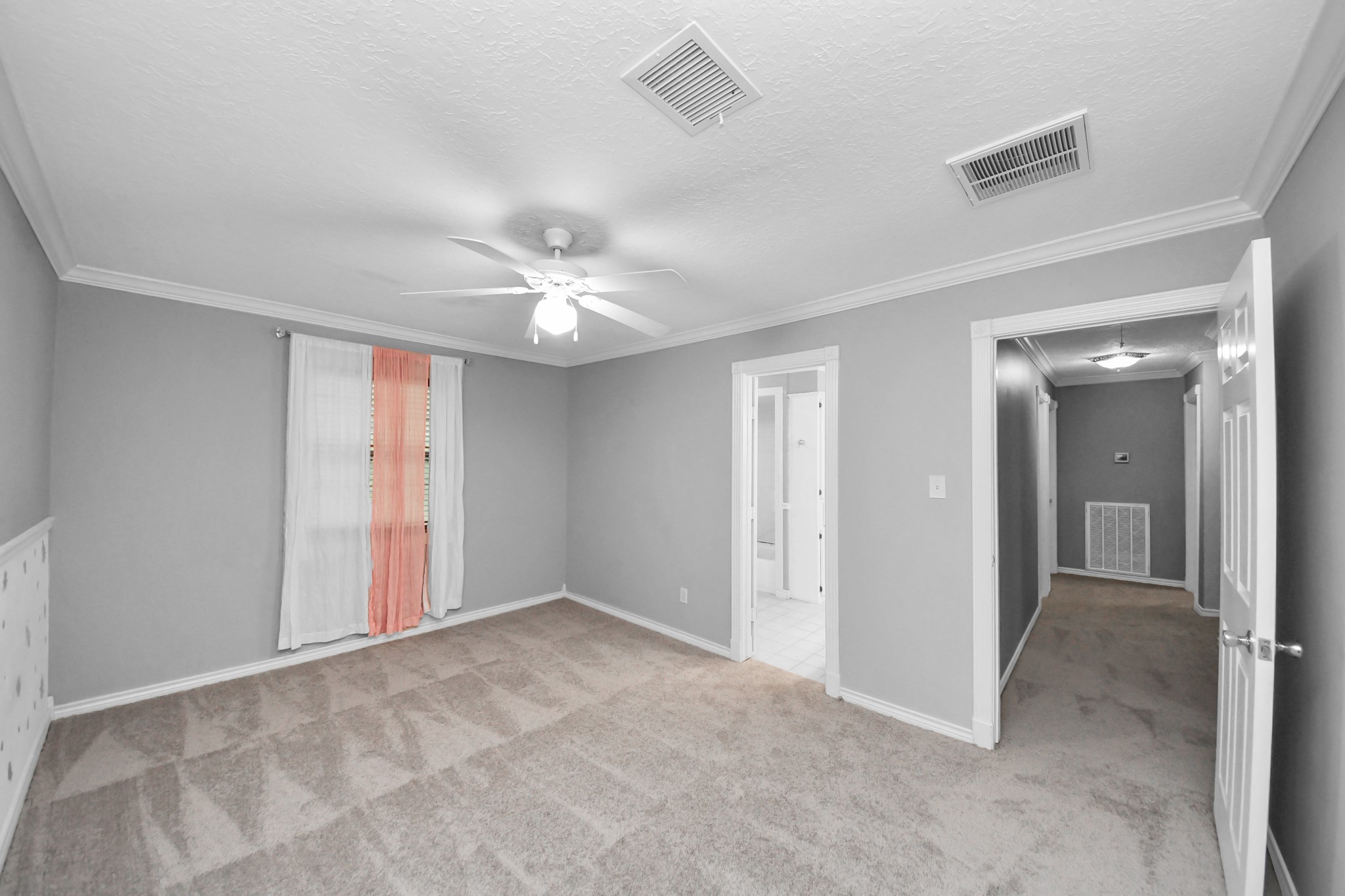 1719 Saddlecreek Drive Houston, TX 77090 - Photo 27 of 38 a view of an empty room with a chandelier fan
