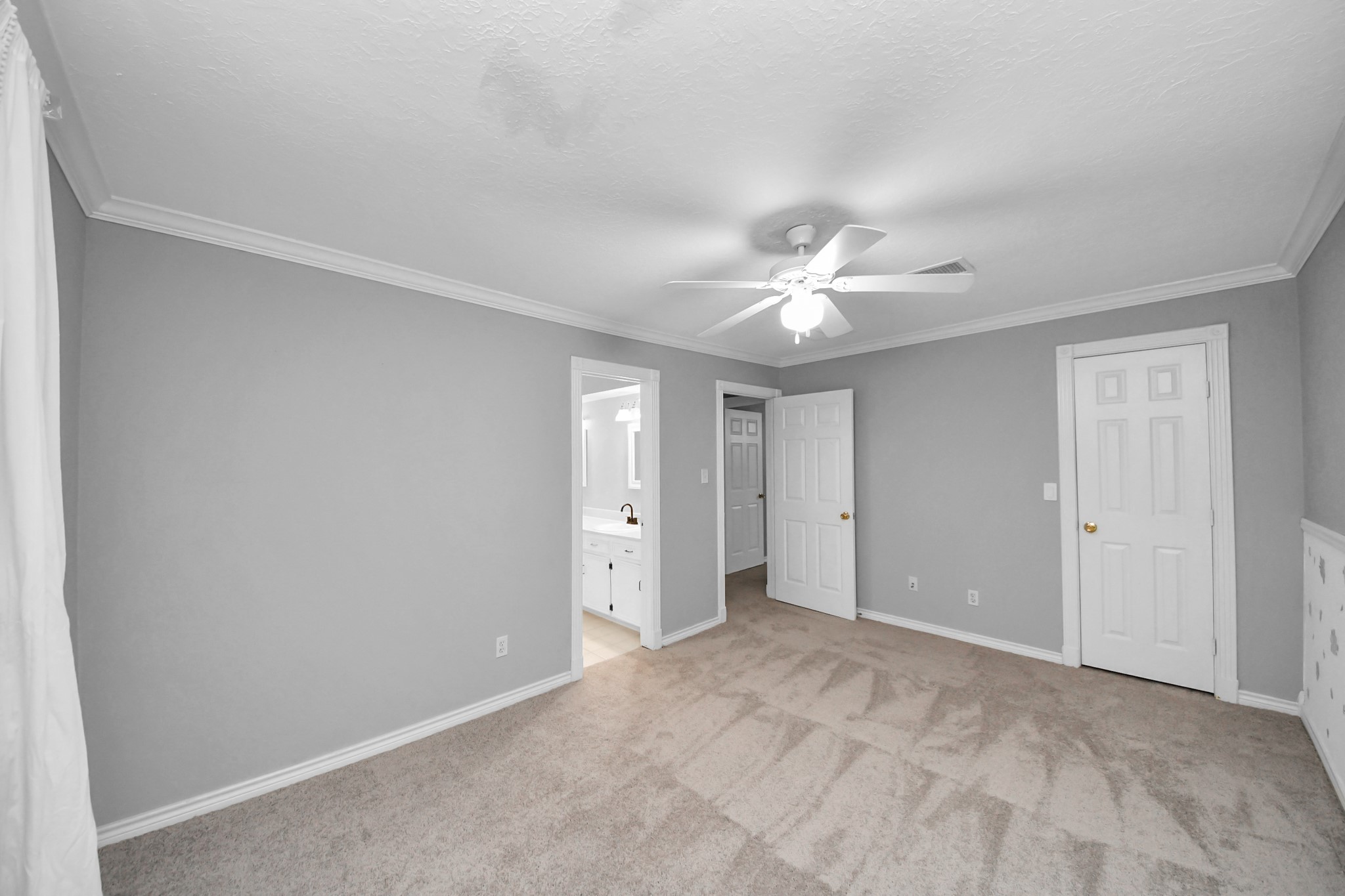 1719 Saddlecreek Drive Houston, TX 77090 - Photo 28 of 38 a view of an empty room with a chandelier fan