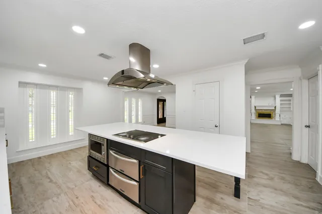 a bathroom with a sink vanity and a mirror