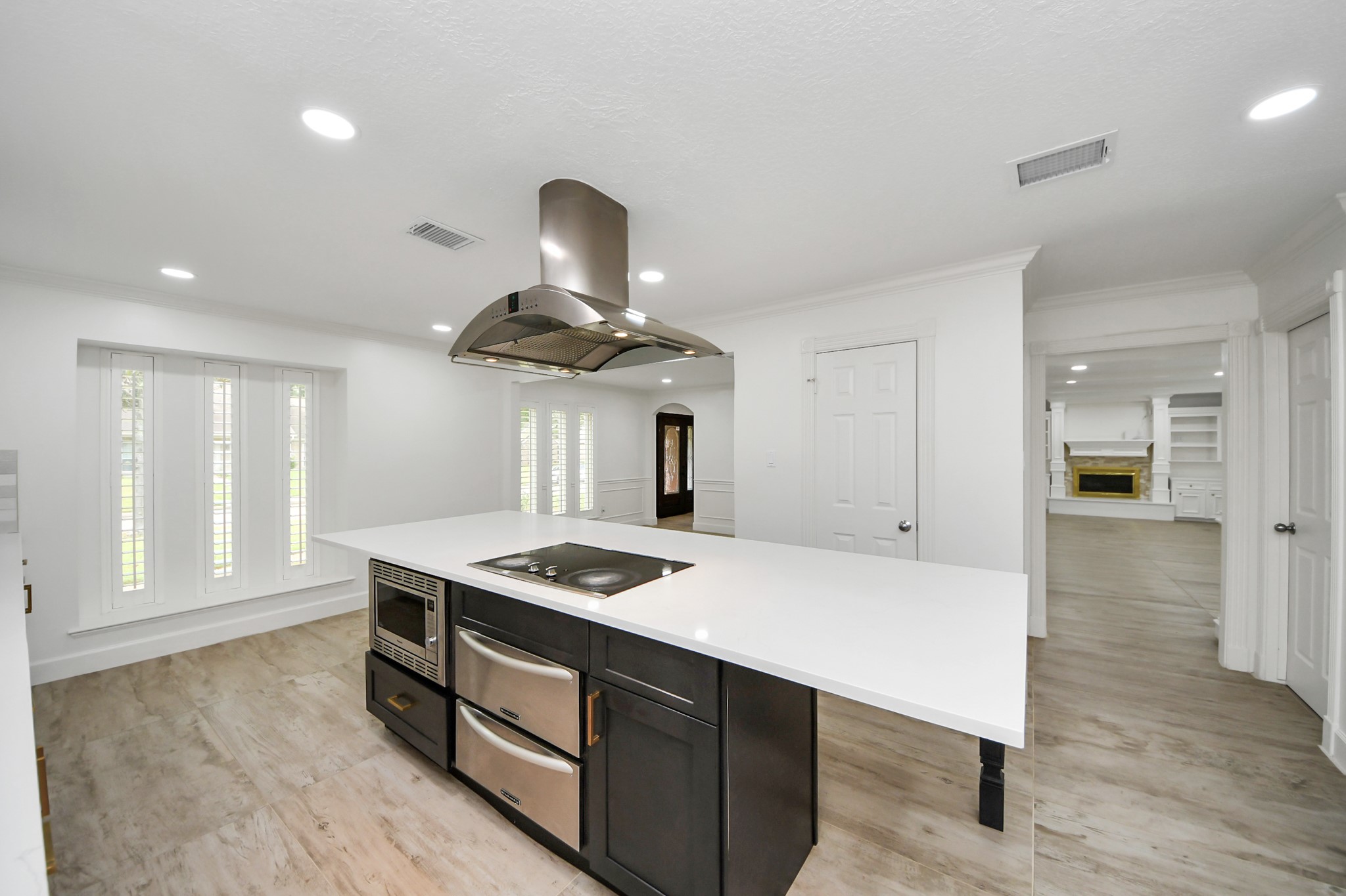 1719 Saddlecreek Drive Houston, TX 77090 - Photo 5 of 38 a kitchen with stainless steel appliances granite countertop a sink a stove and a refrigerator
