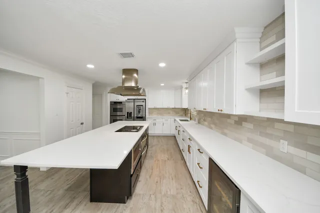 a view of an empty room and a window