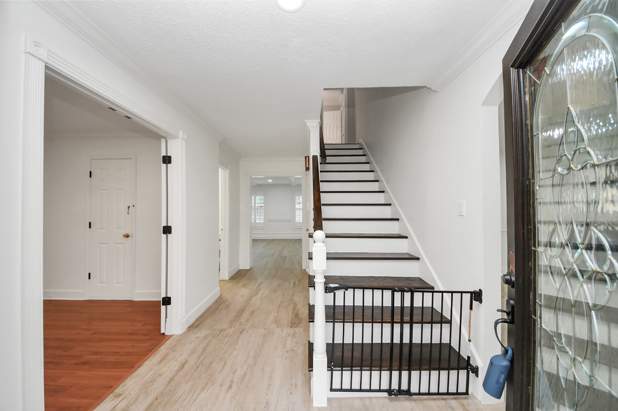 1719 Saddlecreek Drive Houston, TX 77090 - Photo 8 of 38 a view of a hallway with wooden floor and stairs