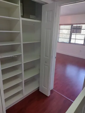 a view of an empty room with a window