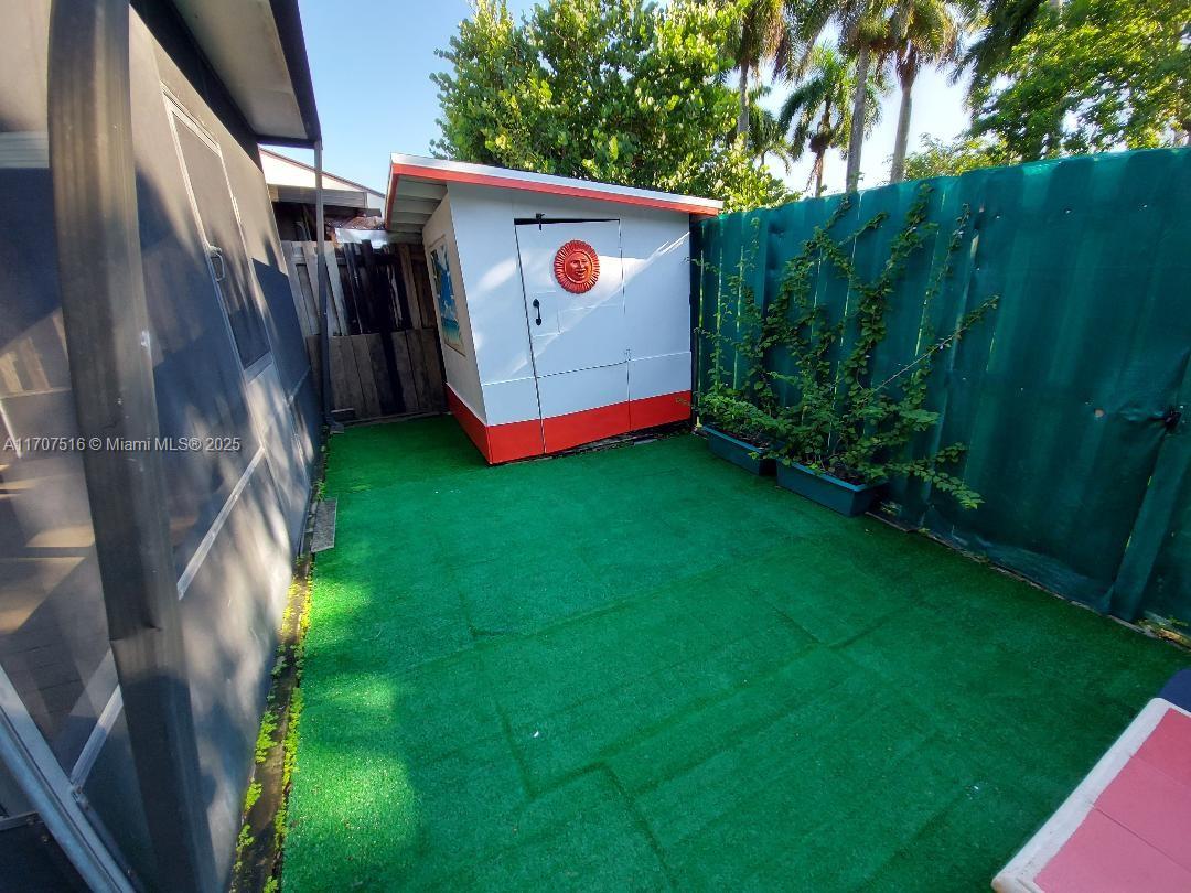 20033 Northeast 2nd Place, Unit 20033 Miami, FL 33179 - Photo 21 of 26 a view of an outdoor space with yard