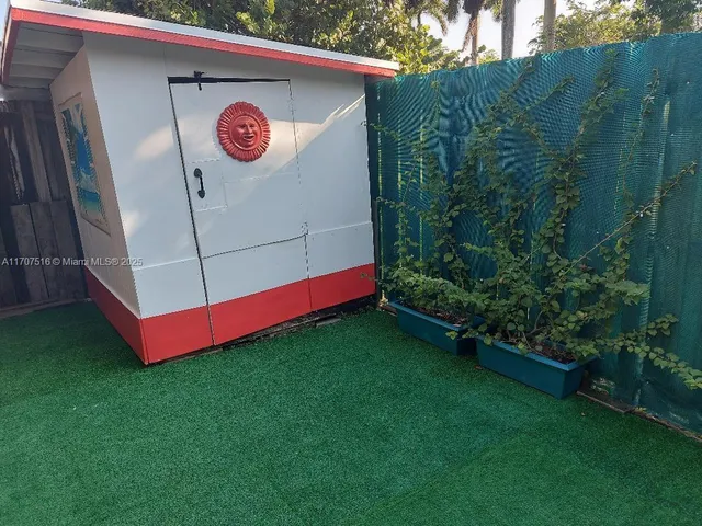 a view of a two chairs in the park