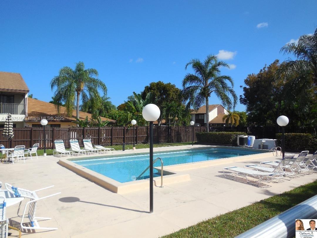 20033 Northeast 2nd Place, Unit 20033 Miami, FL 33179 - Photo 26 of 26 a swimming pool with some potted plants