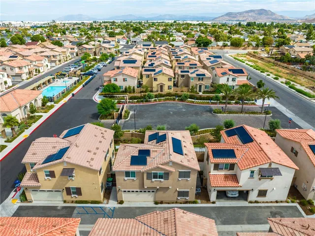 an aerial view of residential houses with outdoor space