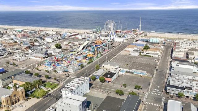 an aerial view of residential building and lake