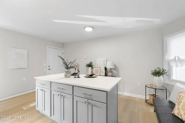 a bathroom with a sink vanity and a mirror