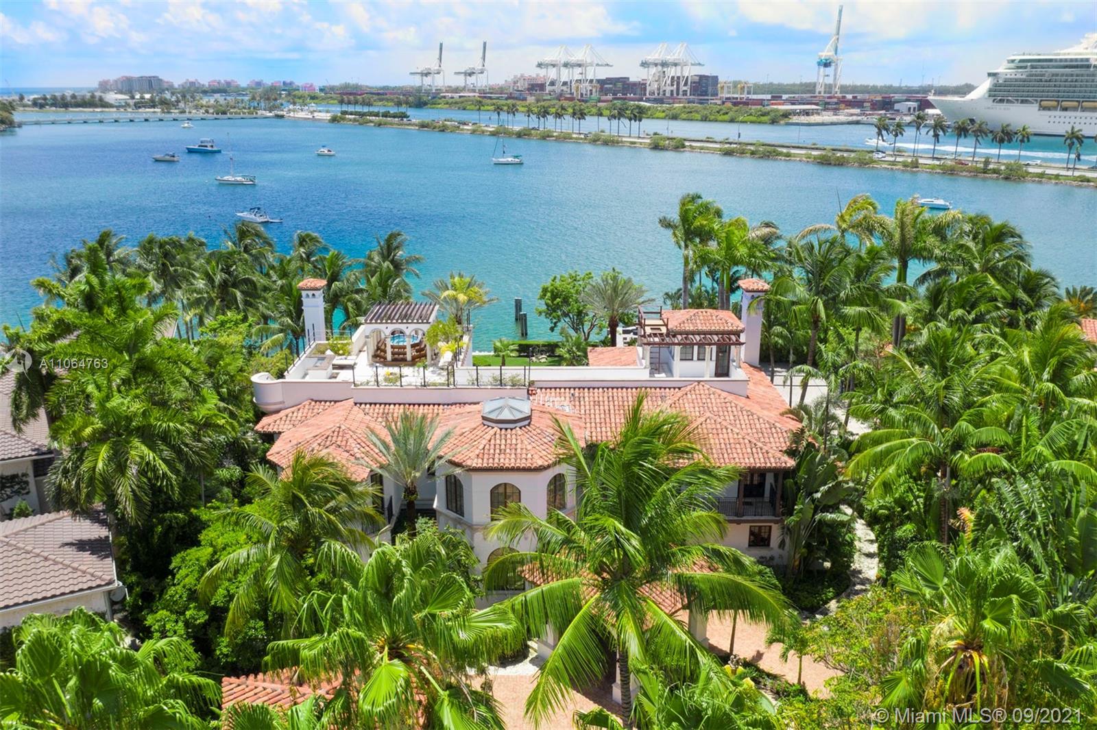 10 Palm Avenue Miami Beach, FL 33139 - Photo 11 of 42 a view of a lake with a table and chairs