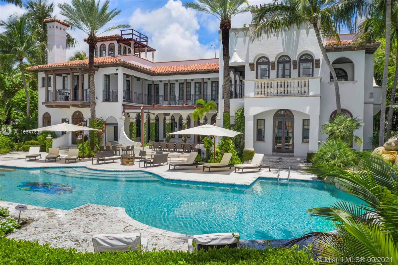 10 Palm Avenue Miami Beach, FL 33139 - Photo 33 of 42 a front view of a house with garden and swimming pool