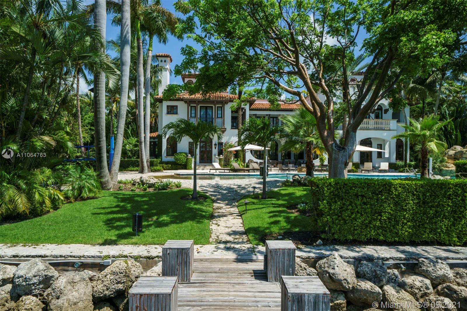 10 Palm Avenue Miami Beach, FL 33139 - Photo 36 of 42 a view of a house with a yard and plants