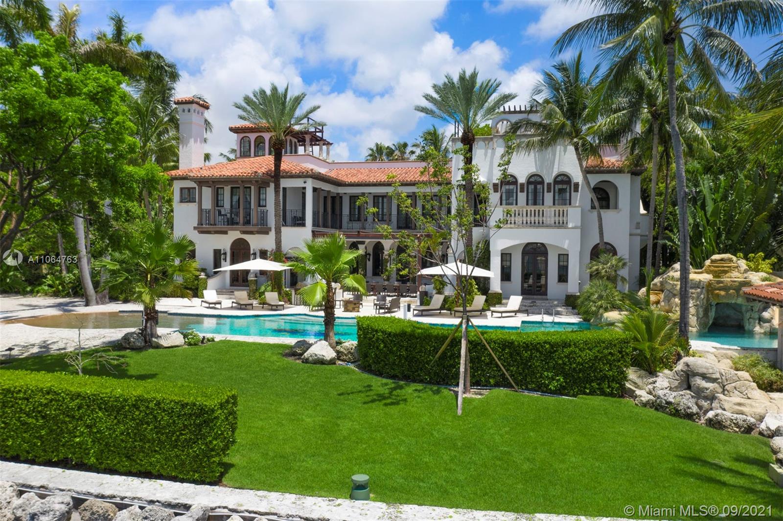 10 Palm Avenue Miami Beach, FL 33139 - Photo 37 of 42 a front view of a house with garden and sitting area