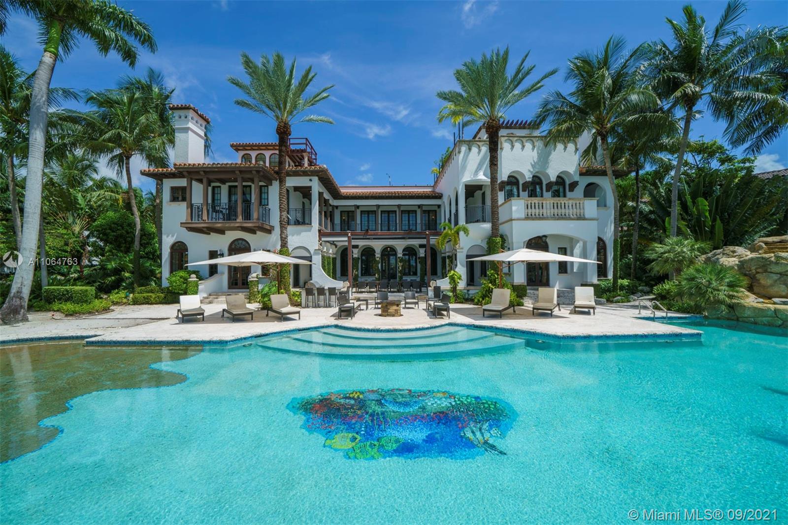 10 Palm Avenue Miami Beach, FL 33139 - Photo 6 of 42 a front view of a house with swimming pool garden and patio
