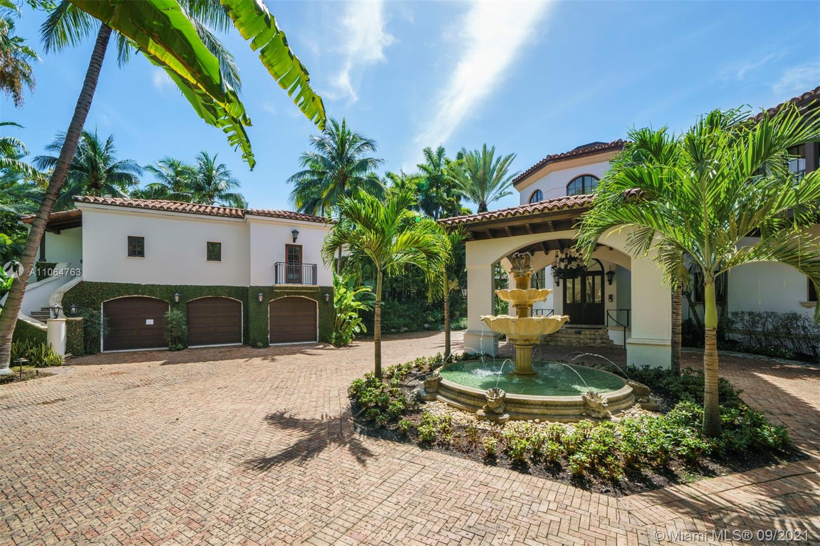 10 Palm Avenue Miami Beach, FL 33139 - Photo 9 of 42 a front view of a house with garden