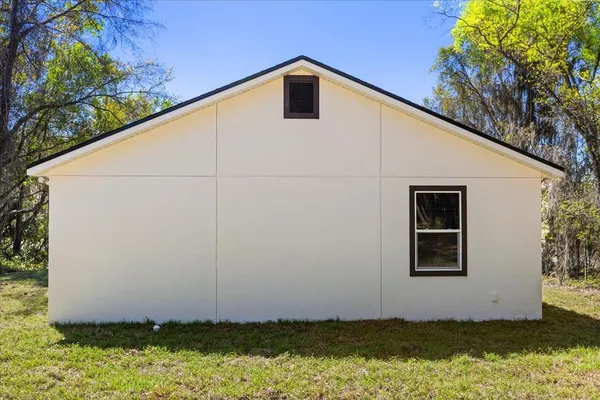 a house with trees in the background