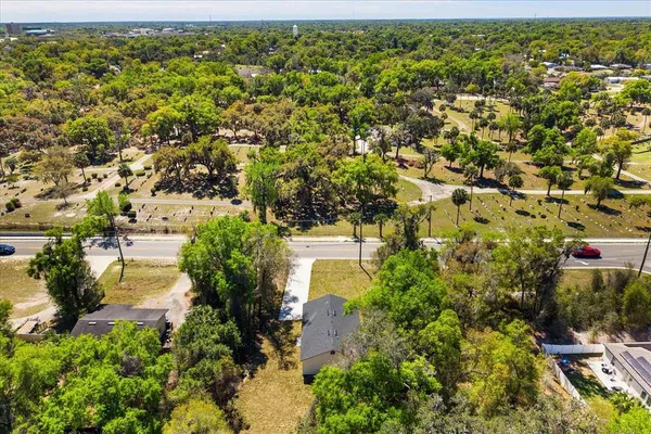 an aerial view of residential building with green space