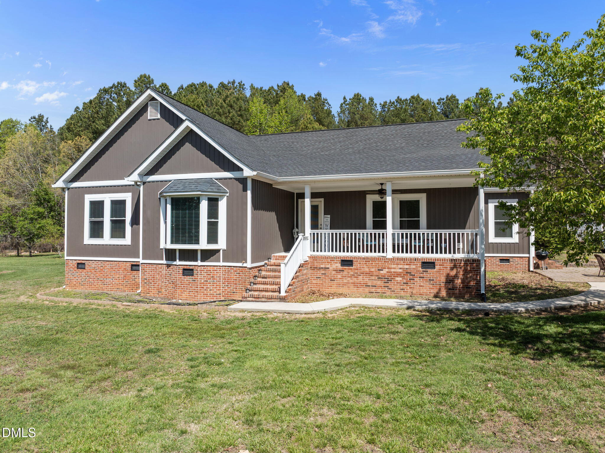236 Dirgie Mine Road Roxboro, NC 27574 - Photo 11 of 55 a front view of a house with a yard