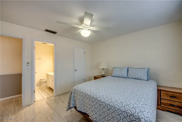 a bedroom with a bed and a walk in closet