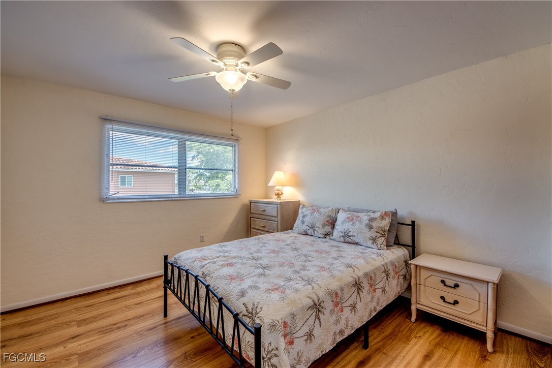 909 Southeast 46th Lane, Unit 202 Cape Coral, FL 33904 - Photo 25 of 38 a bedroom with a bed and a window
