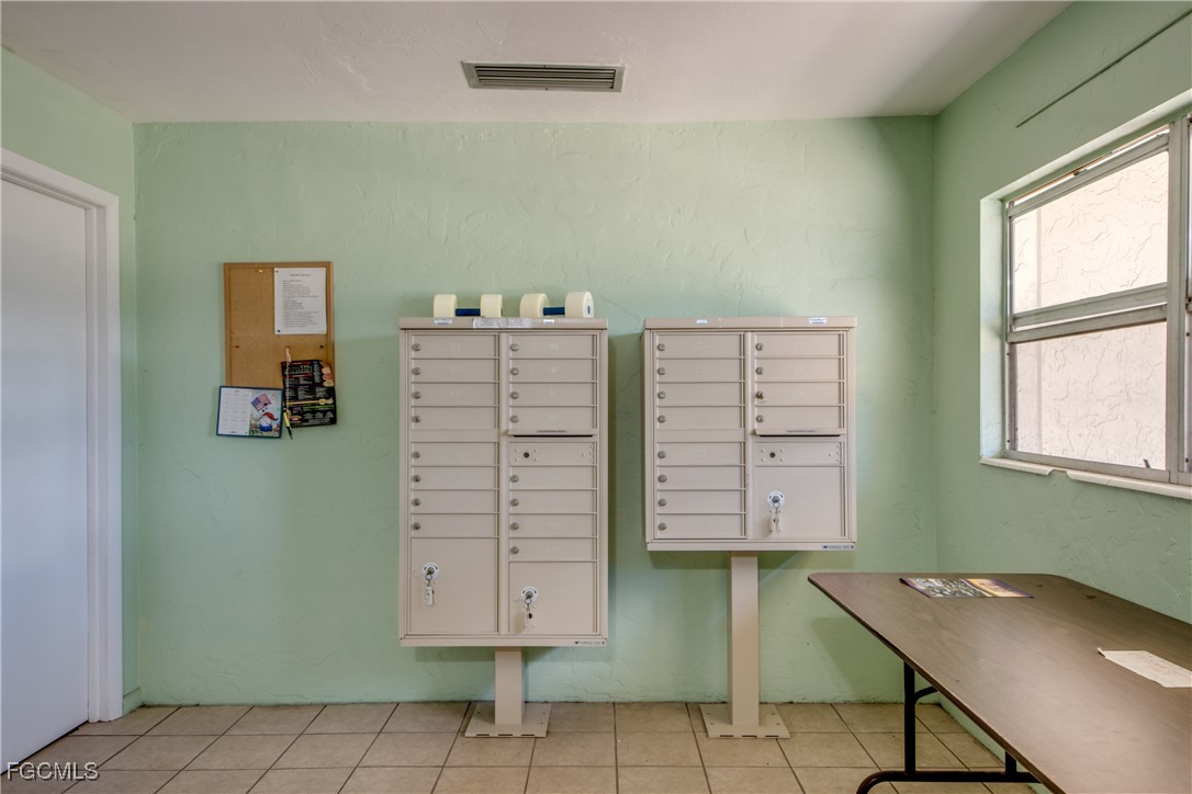 909 Southeast 46th Lane, Unit 202 Cape Coral, FL 33904 - Photo 37 of 38 a view of room with window and chair