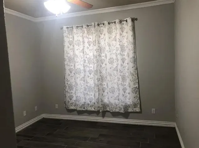 a bathroom with a sink a toilet and window