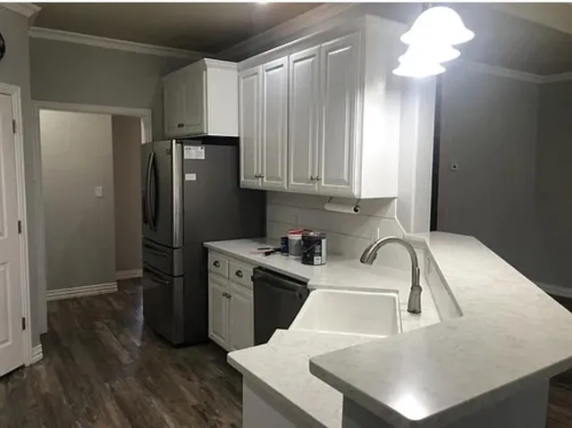 a bathroom with a sink and a large mirror