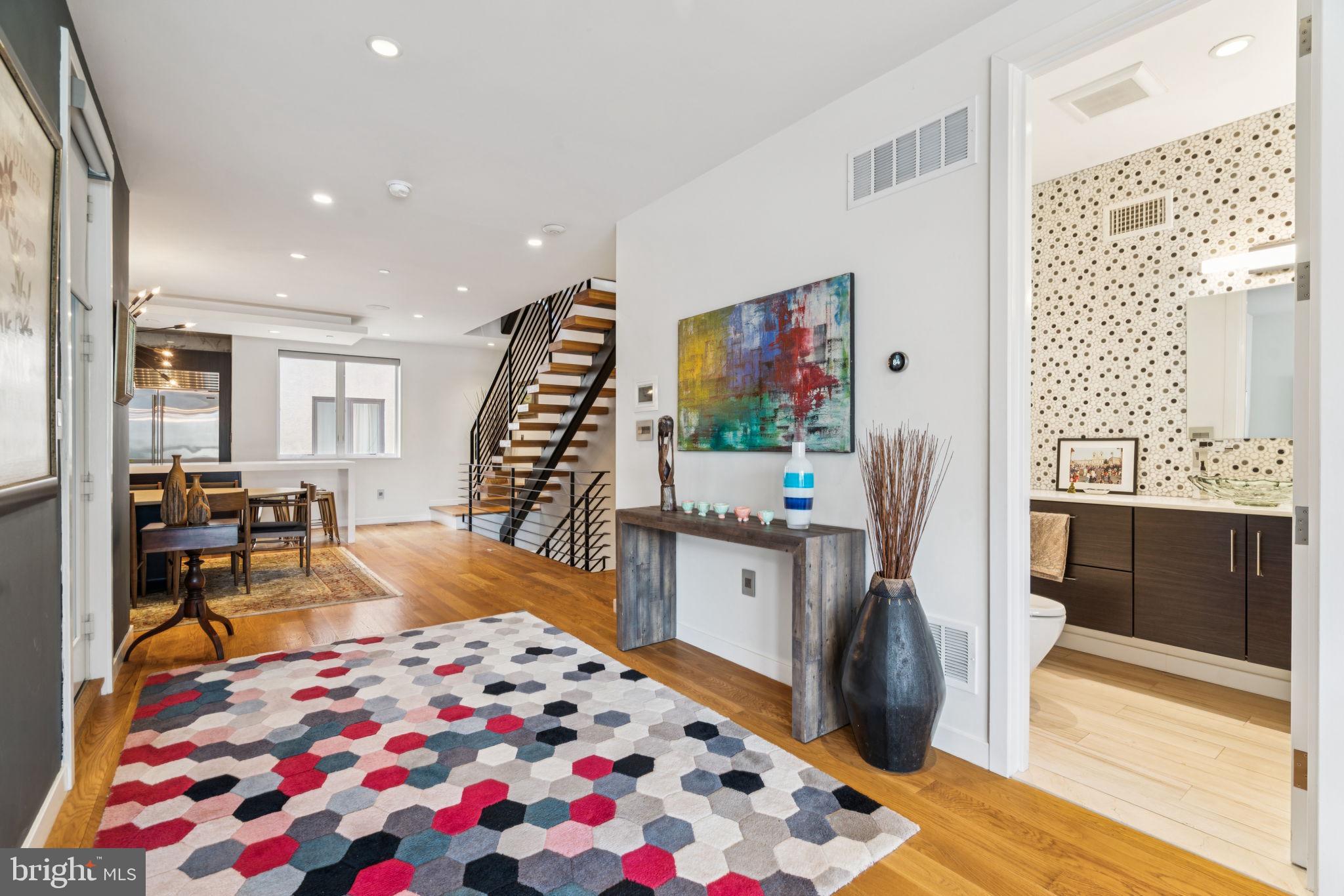 206 North 22nd Street, Unit E Philadelphia, PA 19103 - Photo 13 of 50 a living room with furniture and a flat screen tv
