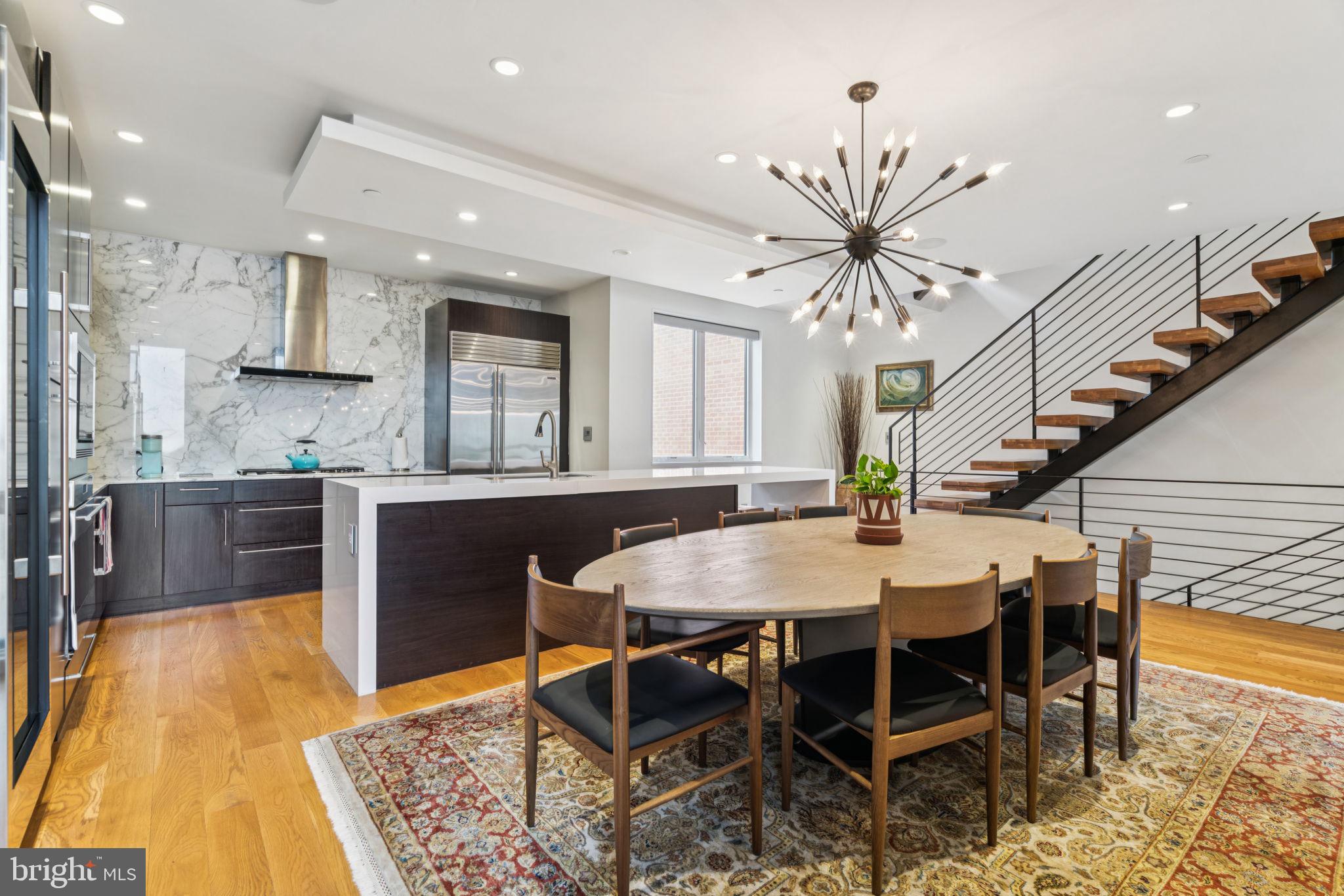 206 North 22nd Street, Unit E Philadelphia, PA 19103 - Photo 17 of 50 a view of a dining room with furniture and wooden floor