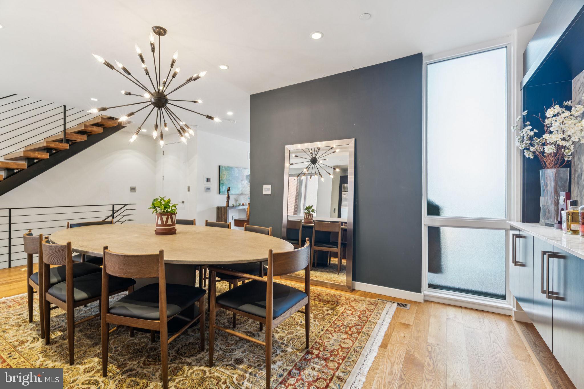 206 North 22nd Street, Unit E Philadelphia, PA 19103 - Photo 20 of 50 a view of a dining room with furniture and wooden floor