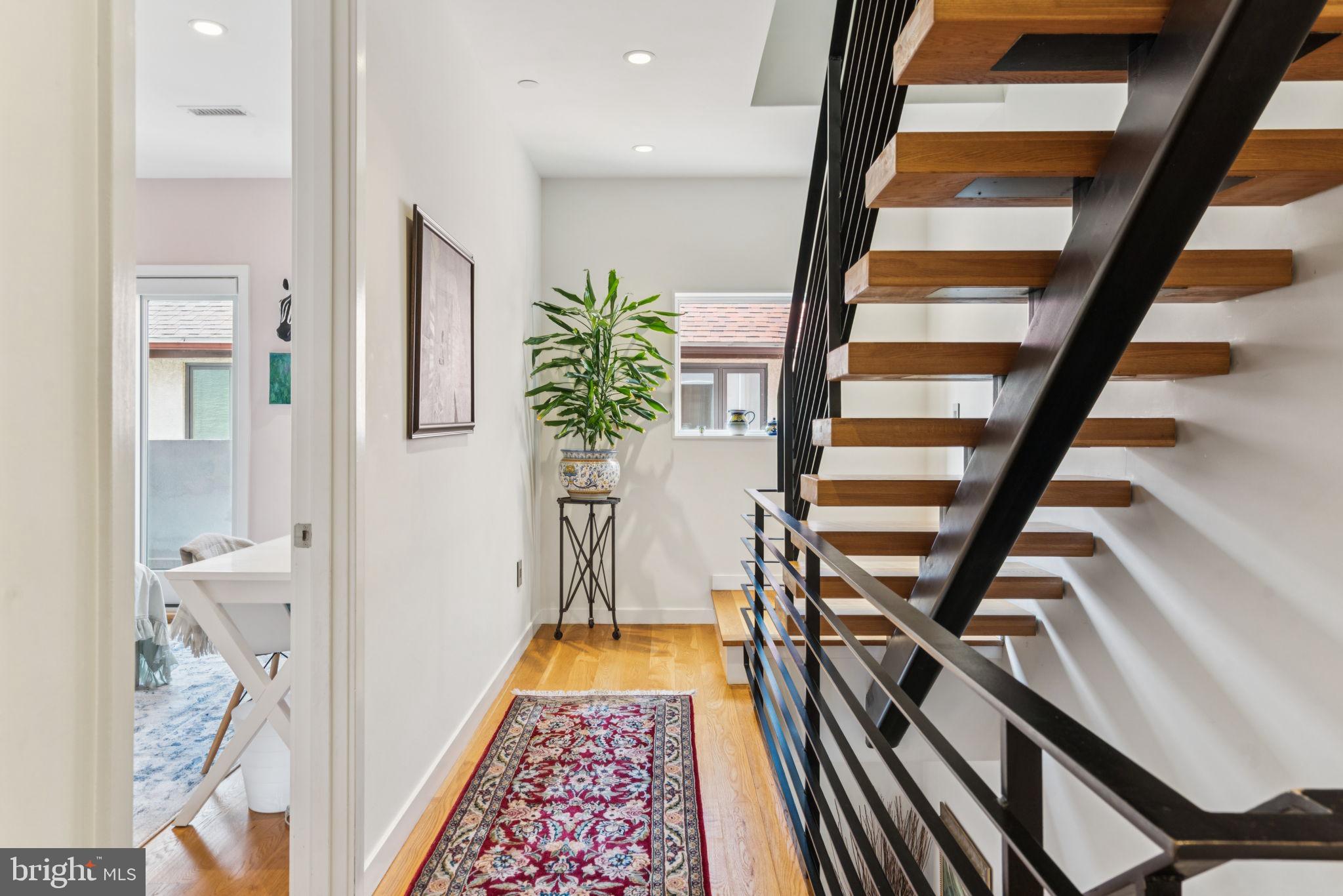 206 North 22nd Street, Unit E Philadelphia, PA 19103 - Photo 23 of 50 a view of an entryway with wooden floor and a potted plant